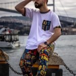 White T-shirt with colorful printed pocket and trims by Isla Elegance