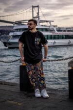 Black T-shirt with colorful printed pocket and trims by Isla Elegance